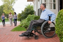 Man in wheelchair at door